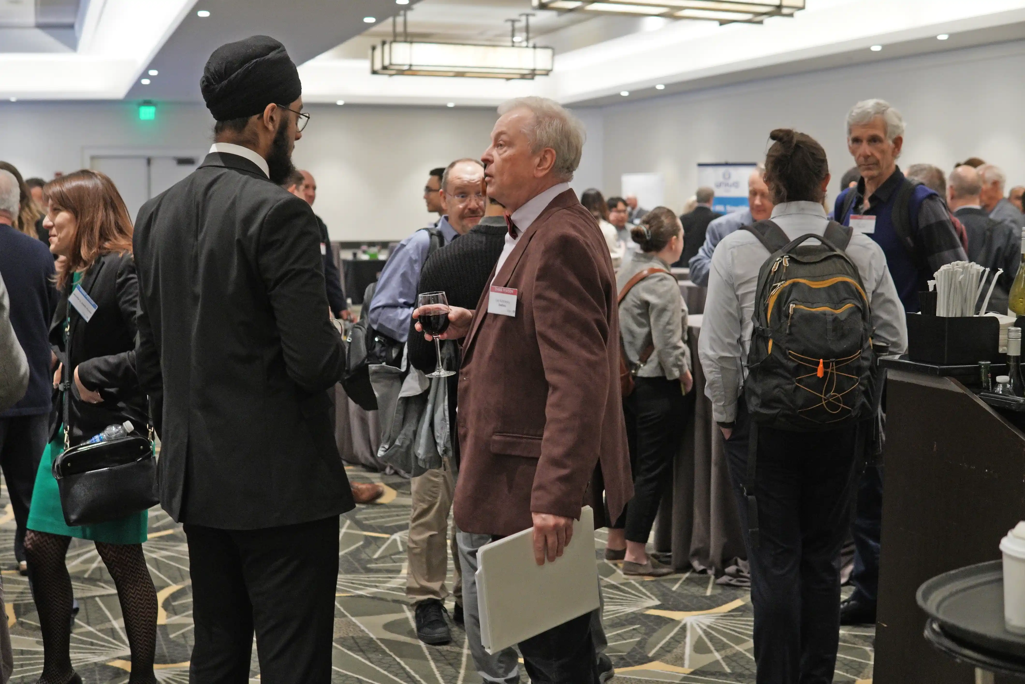 Professionals networking at a biotech conference